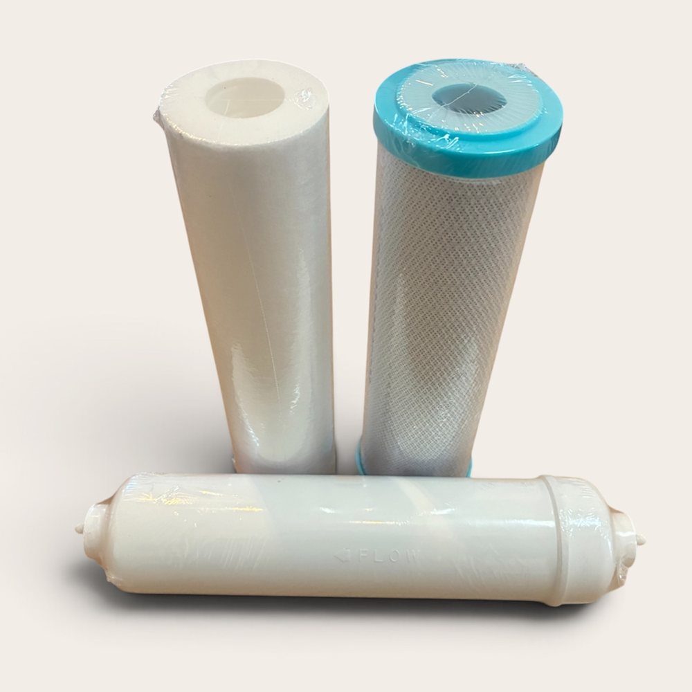 The three cartridges in the CHF-compatible RO annual filter kit: polyspun sediment cartridge, coconut carbon block, and inline alkalising remineraliser