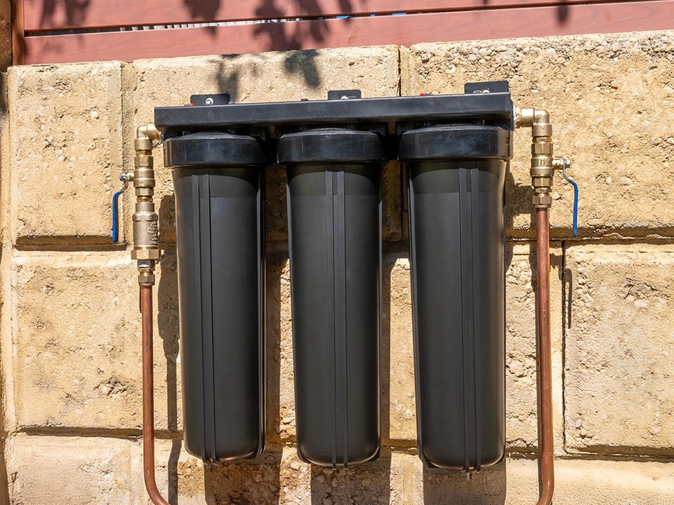 A three stage system fixed to a limestone wall, cover off