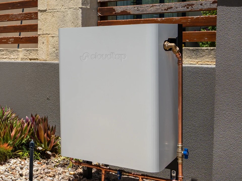 A covered system standing on its post mount in a garden bed